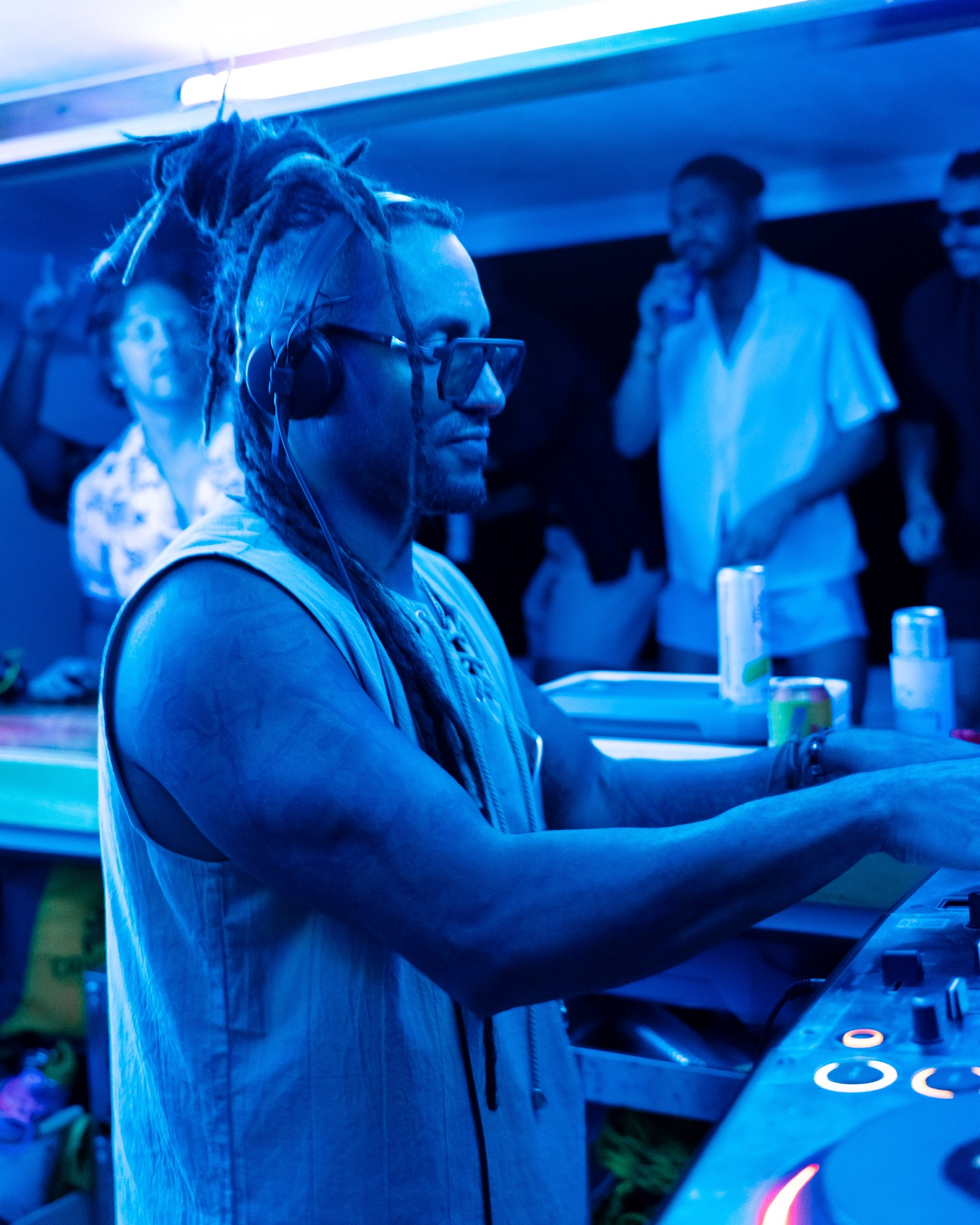 Tiago Black DJing under blue stage lighting