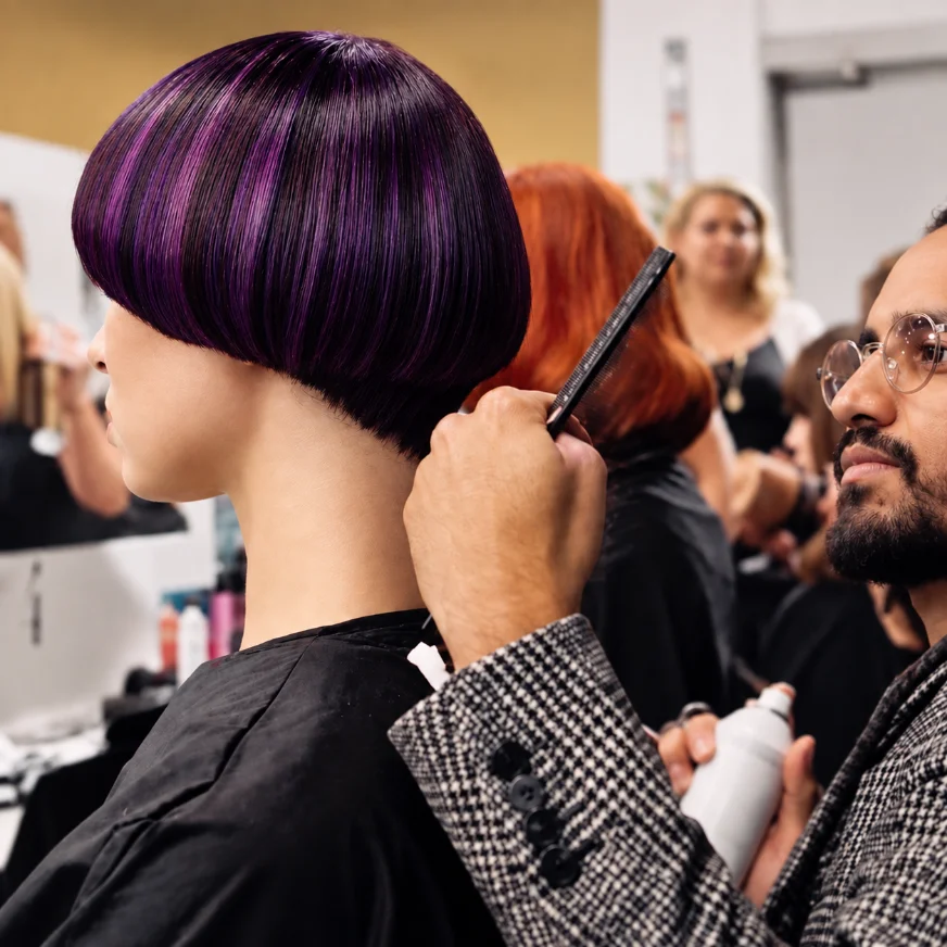 Tiago Rodrigues styling a client's hair