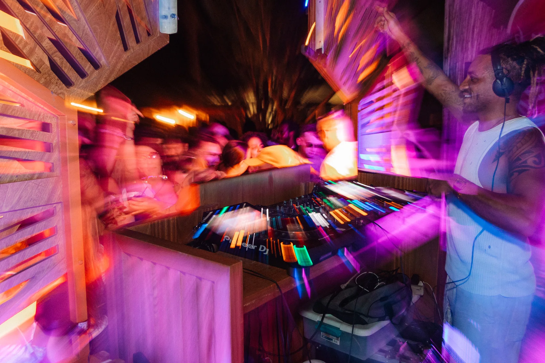Tiago Black mixing during a night-time performance