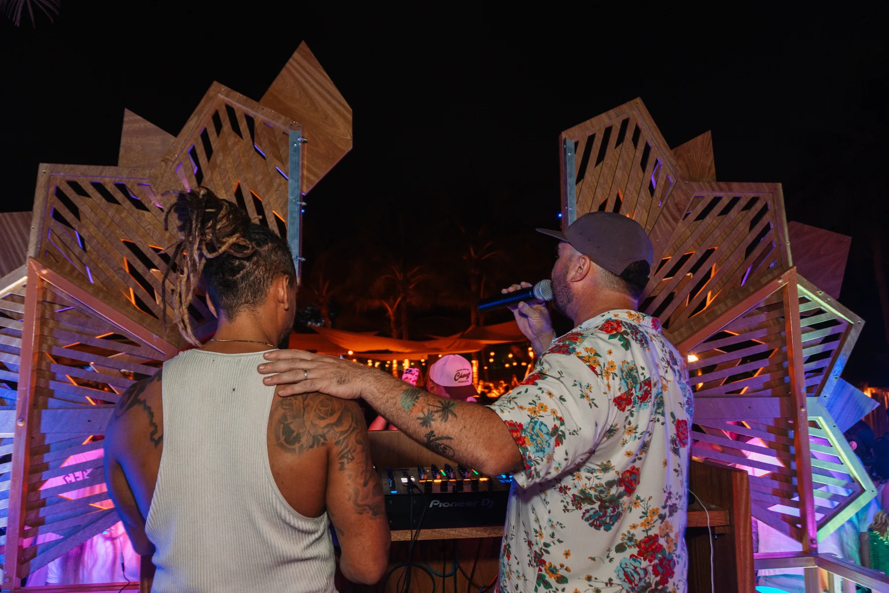 Tiago Black at the decks beside another performer